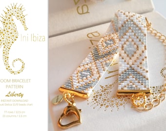 May include: A white and gray beaded loom bracelet with a gold clasp and chain. The bracelet is 12.5 cm long and 1.5 cm wide. The pattern is called "Liberty".