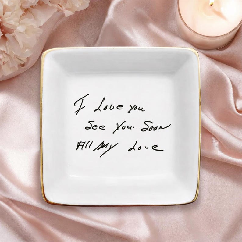 May include: White square ceramic trinket dish with gold trim. The dish features handwritten text in black ink: "I Love you, See you soon, All my love."