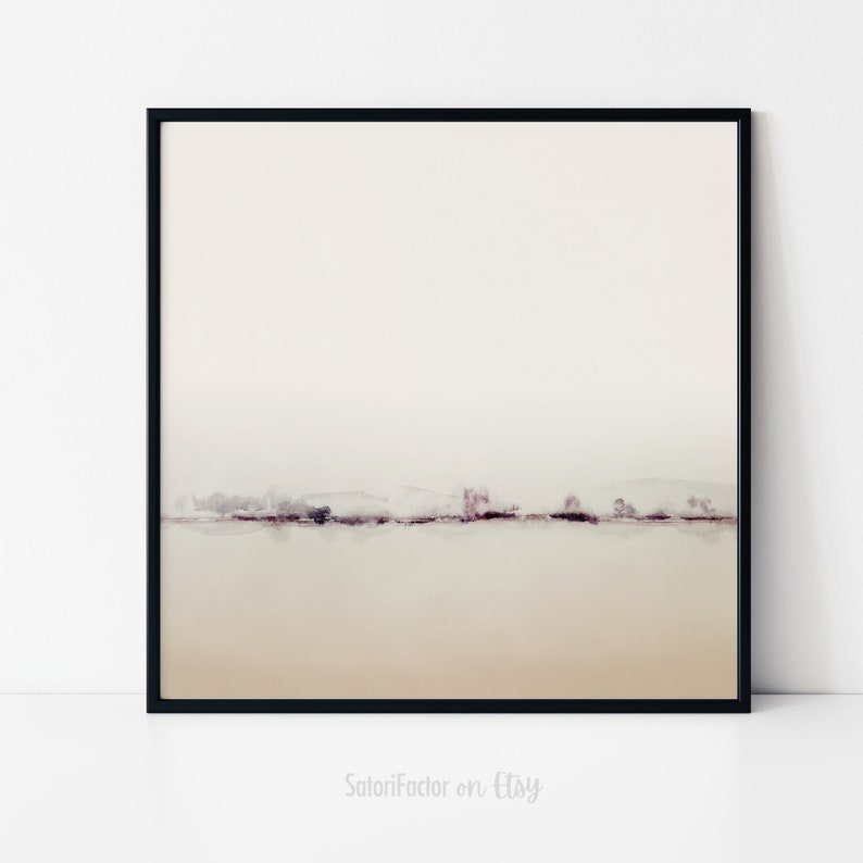 May include: A minimalist abstract landscape painting with a muted color palette. The painting features a thin line of trees and hills in shades of purple and brown against a white background. The painting is framed in a black frame.