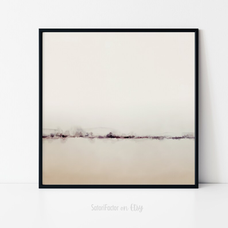 May include: A minimalist watercolor painting of a landscape with a thin line of trees in the distance. The background is a light beige color, and the foreground is a slightly darker beige color. The painting is framed in a black frame.