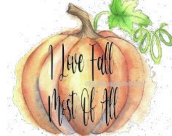 May include: Watercolor illustration of a pumpkin with the text "I Love Fall Most Of All". The pumpkin is orange and yellow with a brown stem and green vine. The background is white with light yellow watercolor splashes.