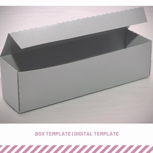 May include: A gray cardboard box with a hinged lid, open to reveal the empty interior. The box is designed for packaging and shipping.