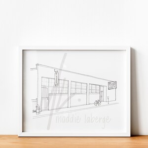 May include: Black and white line drawing of a building with a sign that reads "The Bakehouse" and another sign that reads "West Haven Playmakers & Bowling Inc.". There are two bicycles parked in front of the building.
