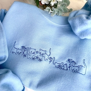 Sudadera con cuello redondo bordado de gatitos adorables