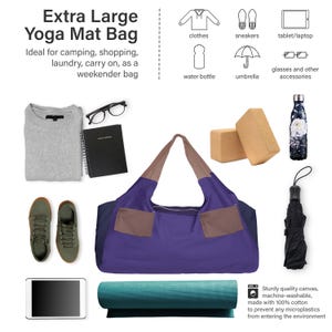 May include: An extra-large yoga mat bag in purple, brown, and navy blue, with two front pockets. The image also shows a gray sweater, sneakers, a tablet, a water bottle, an umbrella, and a yoga mat. The bag is made of sturdy canvas.