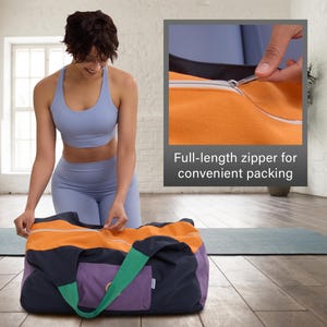 May include: A multi-colored duffel bag with a full-length zipper. The bag features orange, purple, navy, and green panels. The text "Full-length zipper for convenient packing" is visible. A person is shown opening the zipper.