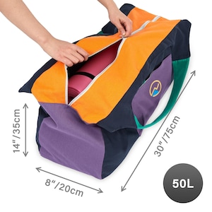 May include: Color-blocked yoga bag in orange, navy, purple, and green. The bag is open, revealing a pink yoga mat inside. The bag measures 30 inches long, 14 inches high, and 8 inches wide. A purple pocket features a logo. The bag has a 50L capacity.