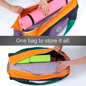 May include: A multi-colored duffel bag featuring orange, dark blue, purple, and green panels with a circular logo. The bag contains a pink yoga mat, two lime green yoga blocks, and a grey textured item. The text reads: One bag to store it all.