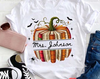 Personalized Pumpkin Book Teacher Shirt, Custom Name Halloween T-Shirt, Ghost Bat Spider Classroom Tee, Fall Teacher Gift