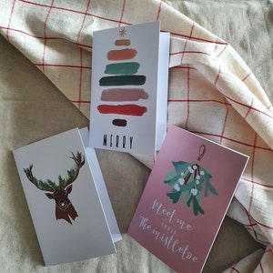 Dubbelgevouwen Holidaypack met drie kaarten