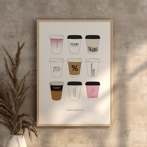 May include: A framed print featuring illustrations of nine different coffee cups from London coffee shops. The cups are arranged in a grid pattern and each cup has a unique design and text, including "Ozone", "Watc", "Allpress", and "Climpson's", among others. The print is titled "London Coffee Cups".