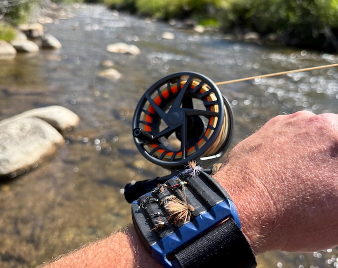 A fly fishing MUST HAVE! Easy on-arm access to your flies, change on the go without opening a fly box. Tested ripple foam secures your flies
