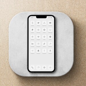 May include: A smartphone with a white background and a grid of app icons, including Netflix, Twitter, App Store, YouTube, PayPal, Pinterest, Chase, Lightroom, Shopify, Dropbox, Slack, Safari, LinkedIn, Instagram, TikTok, Weather, Telegram, Snapchat, Facebook, and Amazon. The phone also has icons for phone, messages, settings, and camera.