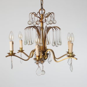 Very nice early 20th century brass chandelier with many glass drops and leave prisms excellent condition!