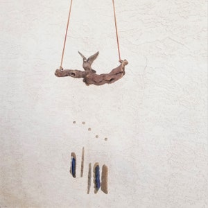 Colorado Windsongs | Bird | wind chime | handmade | artisan | stoneware | earthenware | grapevine | wood | outdoor | guarantee