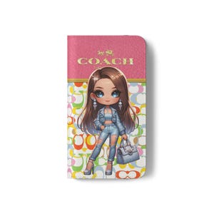 May include: A pink and multi-colored Coach phone case featuring a cartoon illustration of a woman in denim. The case has the Coach logo in gold lettering at the top. The woman is holding a purse and wearing high heels.