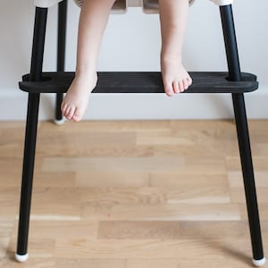 Black footrest for Ikea Antilop Highchair. Antilop footrest. Evenflow foot rest. Adjustable baby chair a leg wraps