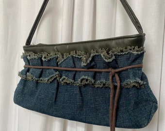 vintage 00s 90s Y2K Denim and Khaki Faux Leather Mini Shoulder Baguette Bag with Lace frill Detail and Furry Pom Pom Charms