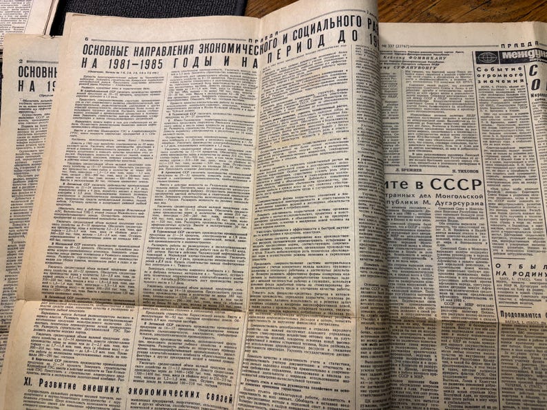 May include: A black and white newspaper page with the headline "Основные направления экономического и социального развития на 1981-1985 годы и на период до 19" in Cyrillic script. The article discusses economic and social development in the USSR.