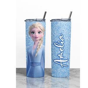 May include: A blue and white glitter tumbler with a picture of Elsa from Frozen and the name Amelia on it.