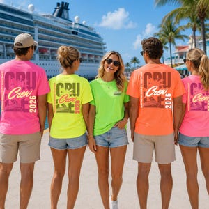 May include: A group of five t-shirts in neon pink, neon yellow, and neon orange. The shirts feature a graphic design on the back with the text "CRU Crew 2026" and "MAKING MEMORIES TOGETHER" alongside an illustration of a cruise ship and palm trees.
