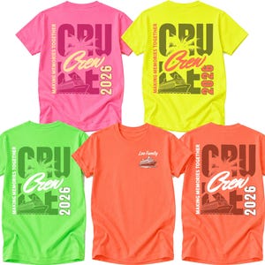 May include: Five short-sleeved t-shirts in neon pink, yellow, green, and orange. Four shirts feature a large back graphic with a cruise ship, palm tree, and the text "CRUISE CREW 2026 MAKING MEMORIES TOGETHER." One orange shirt shows a small front chest graphic.