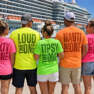 May include: Five t-shirts in bright neon colors featuring dark text on the back. The shirts read: The Salty One in pink, The Loud One in yellow, The Tipsy One in lime green, The Nauti One in orange, and The Chill One in pink, worn by five people.