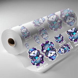 May include: A roll of stickers featuring a cartoon polar bear wearing a winter hat and jacket, holding a keyboard. The stickers have the text "Frosty Keys" and are in shades of purple, blue, and white.
