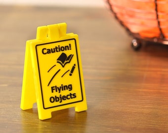 Caution Flying Objects - Mini Desk Sign