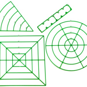 May include: Four green plastic floral foam rings in different shapes. The rings are marked with numbers indicating their size in inches. The shapes include a circle, a square, a triangle, and a long rectangle.