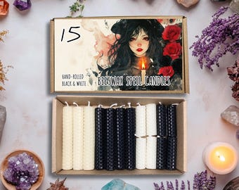 May include: A box of 15 hand-rolled beeswax spell candles. The box has a black and white design with the text "Beeswax Spell Candles" and "Hand-rolled Black & White". The candles are in a separate box and are black and white.