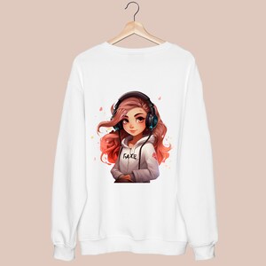 May include: White sweatshirt with a colorful illustration of a girl wearing headphones and a hoodie with the word "FAKE" on it.