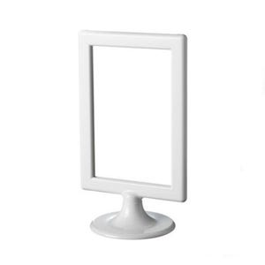 May include: A white, rectangular picture frame with a stand. The frame is empty, with a clean, minimalist design. The stand is round and supports the frame, creating a tabletop display.