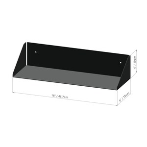 May include: Black metal shelf with angled sides. The shelf measures 18 inches wide by 6 inches deep by 4 inches high.