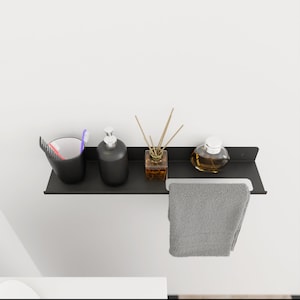 Minimalistisk badrumshylla i metall med handdukshängare - Modern badrumsorganisatör bild 3