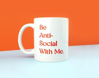May include: White ceramic mug with the text "Be Anti-Social With Me." printed in red.
