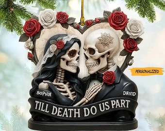 May include: A decorative ornament featuring a skeletal bride and groom embracing, surrounded by red and white roses. The ornament has the text "TILL DEATH DO US PART" and the names "SOPHIA" and "DAVID". The ornament is personalized.