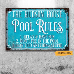 May include: A rectangular turquoise sign with a distressed brown border featuring the white text THE HUDSON HOUSE POOL RULES and three numbered points: 1. RELAX & HAVE FUN, 2. DON'T PEE IN THE POOL, 3. DON'T DO ANYTHING STUPID. A small orange tag says PERSONALIZED.