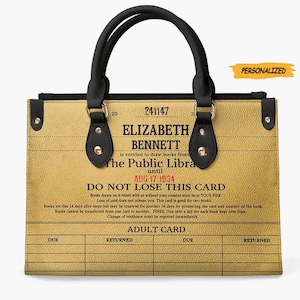 May include: A personalized tote bag with a vintage library card design. The card reads "Elizabeth Bennett is entitled to draw books from The Public Library until Aug 17 1934. Do Not Lose This Card." The bag is brown with black handles and gold accents.