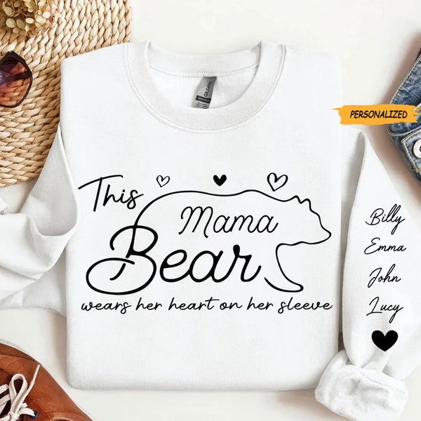 This Mama Bear Wears Her Heart On Her Sleeve – Family Personalized Custom Unisex Sweatshirt With Design On Sleeve – Gift For Mom