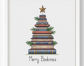 May include: A framed print features a Christmas tree made of stacked books. The books are in various colors, with a gold star on top and sprigs of greenery. The text "Merry Bookmas" is at the bottom.
