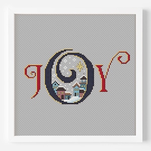 Puede incluir: Patrón de punto de cruz con la palabra "ALEGRÍA" en una fuente estilizada. La "O" está llena de una escena de invierno con casas, una estrella y copos de nieve.