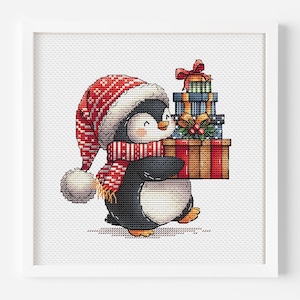 Puede incluir: Un punto de cruz enmarcado de un pingüino con un gorro y bufanda rojos y blancos, llevando una pila de regalos envueltos. Los regalos son de varios colores y patrones, atados con cintas. El pingüino tiene una expresión alegre.