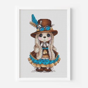 May include: A framed cross-stitch of a bunny wearing a brown steampunk-style outfit. The bunny has a brown hat with goggles and a blue feather. The outfit includes a brown jacket and a blue and brown skirt.