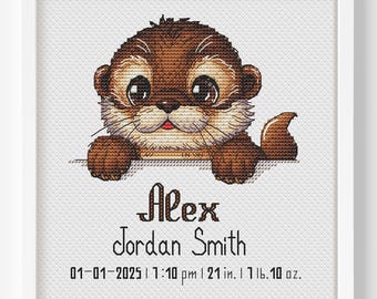 May include: A framed cross-stitch featuring a brown otter with large eyes. The otter is peeking over a white surface. Below the otter is the name "Alex Jordan Smith" and birth details: 01-01-2025, 7:10 pm, 21 in., 1 lb. 10 oz.
