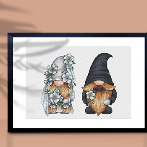 May include: A cross-stitch pattern of two gnomes dressed in wedding attire. The female gnome wears a white dress with a veil and flowers, while the male gnome wears a black suit with a bow tie and flowers.