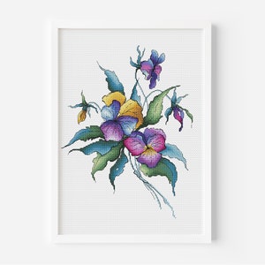 May include: A cross-stitch pattern featuring a bouquet of colorful pansies with yellow, purple, and blue petals. The pansies are surrounded by green leaves and stems.