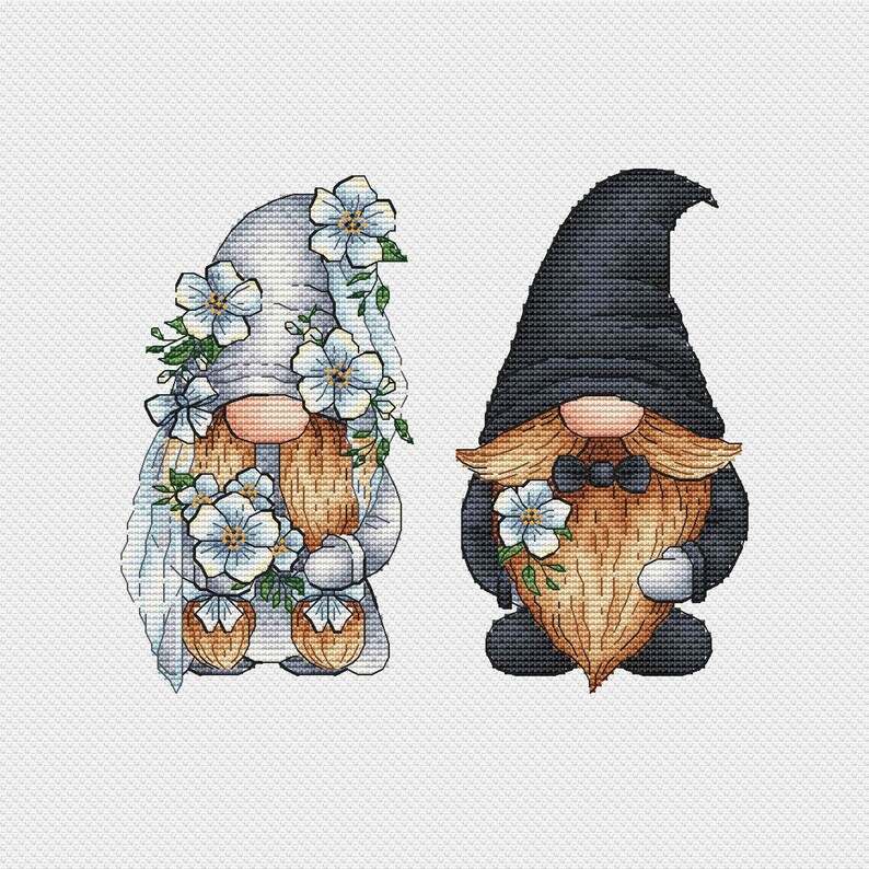 May include: Two gnomes dressed for a wedding. The female gnome wears a white dress with blue flowers and a veil. The male gnome wears a black suit with a bow tie and holds a bouquet of blue flowers.