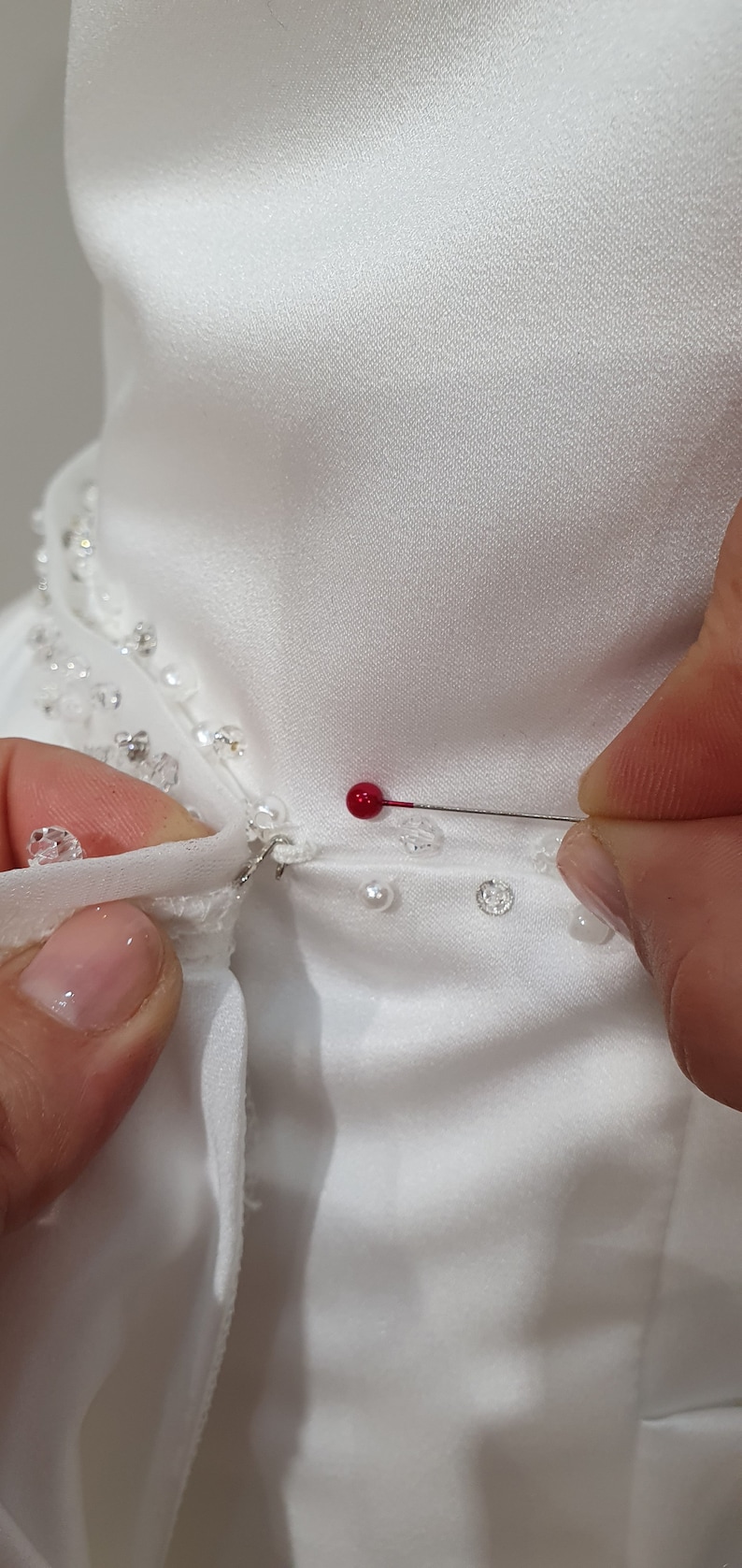 Attachment with hooks of satin overskirt