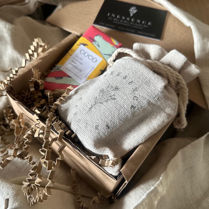 an open box with a book and some other items in it